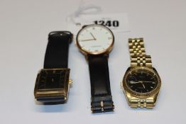 Three men's Sekonda wrist watches.