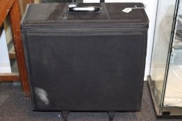 A wheeled carry case with thirteen trays for glasses/sunglasses.