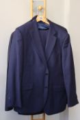 A Tollegno 1900 blue suit size 56, an Emidio Tucci navy blue suit (size unknown), an Argamonte