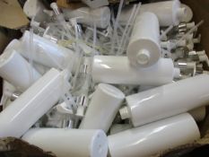 A large quantity of soap dispenser bottles in a white and silver finish.