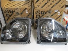 Two boxed as new Jeep Liberty 2008-2012 front headlights (Left/Right).