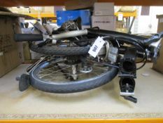 A Pre-owned Brompton foldable bike in black.