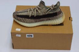 A pair of as new Adidas Yeezy Boost 350 V2 trainers (UK 7).
