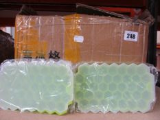 A large quantity of as new green honeycomb silicon ice-cube trays with lid.