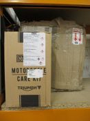 A quantity of boxed as new Triumph motorcycle equipment and related items to include Motorcycles