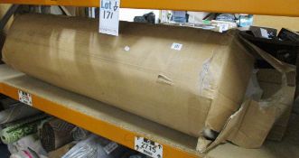 One rolled up double bed mattress.