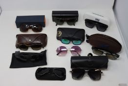 Ten pairs of pre-owned branded sunglasses.