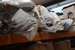 A quantity of umbrellas, walking aids and related items.