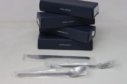 A quantity of as new Georg Jensen Louise Campbell cutlery to include dinner knives and forks,