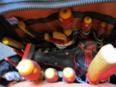 A backpack containing pre-owned tools to include a Milwaukee M18 Compact Impact Driver, a