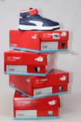 Four pairs of children's as new Puma Rebound Layup trainers (UK 10K, 12K, 1.5, 4).