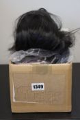 A quantity of wig extensions and related items.