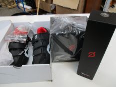 A collection of Peloton items to include: one pair of boxed Peloton cycling shoes (With cleats) in