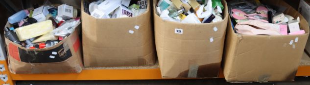 Four boxes of as new and used cosmetics/toiletries.