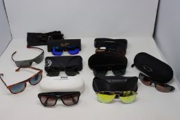 Ten pairs of pre-owned branded sunglasses.