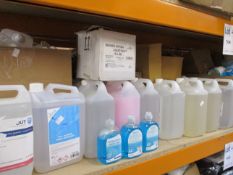 Two shelves of assorted hand sanitizers/soaps and related items.