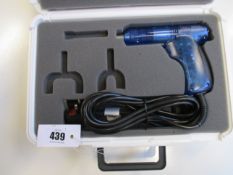 A boxed Chiropractic Impulse Adjusting Gun (Requires attachments).