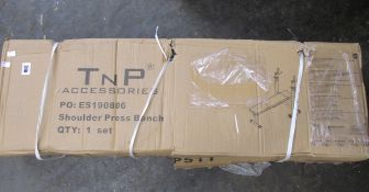 A boxed TnP Accessories folding flat weight bench (Box unopened but damaged. Sold as seen).