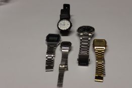 Five Casio wrist watches.