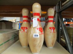 Ten QubicaAMF clear coated bowling pins.