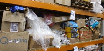 A shelf of miscellaneous items to include nails, chains, dry lining boxes and drill bits.