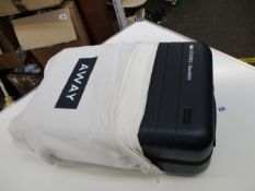 An as new Away navy carry-on luggage.