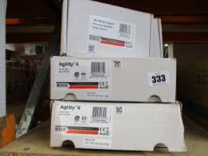 Two Risco Agilty 4 RW132V security panels and two Risco WL Panda Keypads RW332KP, all boxed.