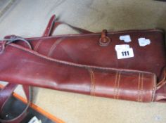 A pre-owned brown leather shooting case with shoulder strap.