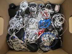 A box of assorted pre-owned in-ear headphones.