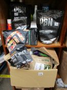 A quantity of miscellaneous fitness supplements and related items to include ESN fruity whey protein