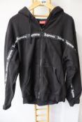 One pre-owned Supreme zip up black hoodie size M.