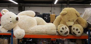 Two giant Teddy Bears.