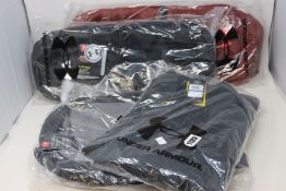 An as new Under Armour X Storm jacket (X L - RRP £70), two Under Armour Undeniable 4.0 duffle bags