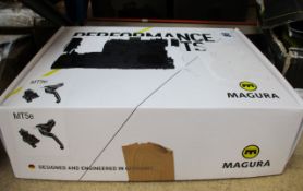 A boxed Magura MT5e front/rear bicycle braking system.
