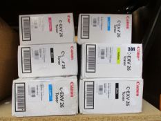Six Canon C-EXV 26 toner cartridges (2 x cyan, 2 x black, 1 x magenta and 1 x yellow).