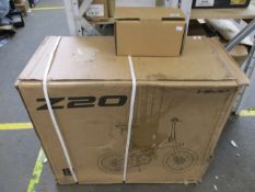 A boxed Himo Z20 folding electric bicycle in white with a box of additional accessories (Some damage