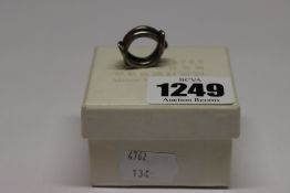 A pre-owned Maison Martin Margiela Interlocked ring in box (S).