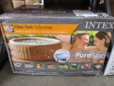 A boxed Intex PureSpa 4-Person Inflatable Jet Spa Hot Tub (May Require UK adaptor).