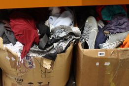 Four large boxes of clothing and related items.