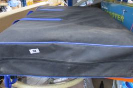 A Quantis folding metal framed massage bed with carry case in white (Some minor damage to leather).