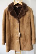 A lady's pre-owned Owen Barry suede/sheepskin coat (14 - Good condition).