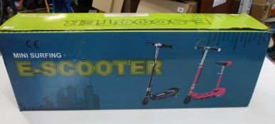 A boxed as new Mini-Surfing electric scooter in blue.