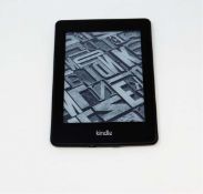A pre-owned Amazon Kindle Paperwhite (EY21) E-reader in Black (some cosmetic wear).