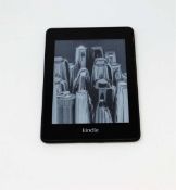 A pre-owned Amazon Kindle Paperwhite (PQ94WIF) E-Reader in Black.