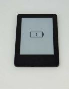 A pre-owned Amazon Kindle Paperwhite (WP63GW) E-reader in Black (some cosmetic wear).