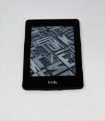 A pre-owned Amazon Kindle Paperwhite (DP75SDI) E-reader in Black (some cosmetic wear).
