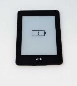A pre-owned Amazon Kindle Paperwhite (DP75SDI) E-reader in Black (some cosmetic wear).