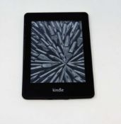 A pre-owned Amazon Kindle Paperwhite (EY21) E-reader in Black (some cosmetic wear).