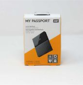 A boxed as-new WD My Passport 4TB Auto Backup Portable Hard Drive in Gray (box sealed).