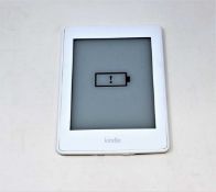 A pre-owned Amazon Kindle Paperwhite (DP75SDI) E-reader in White.